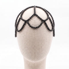 Black crystal Aurelia Noir headpiece on a mannequin, draped silhouette