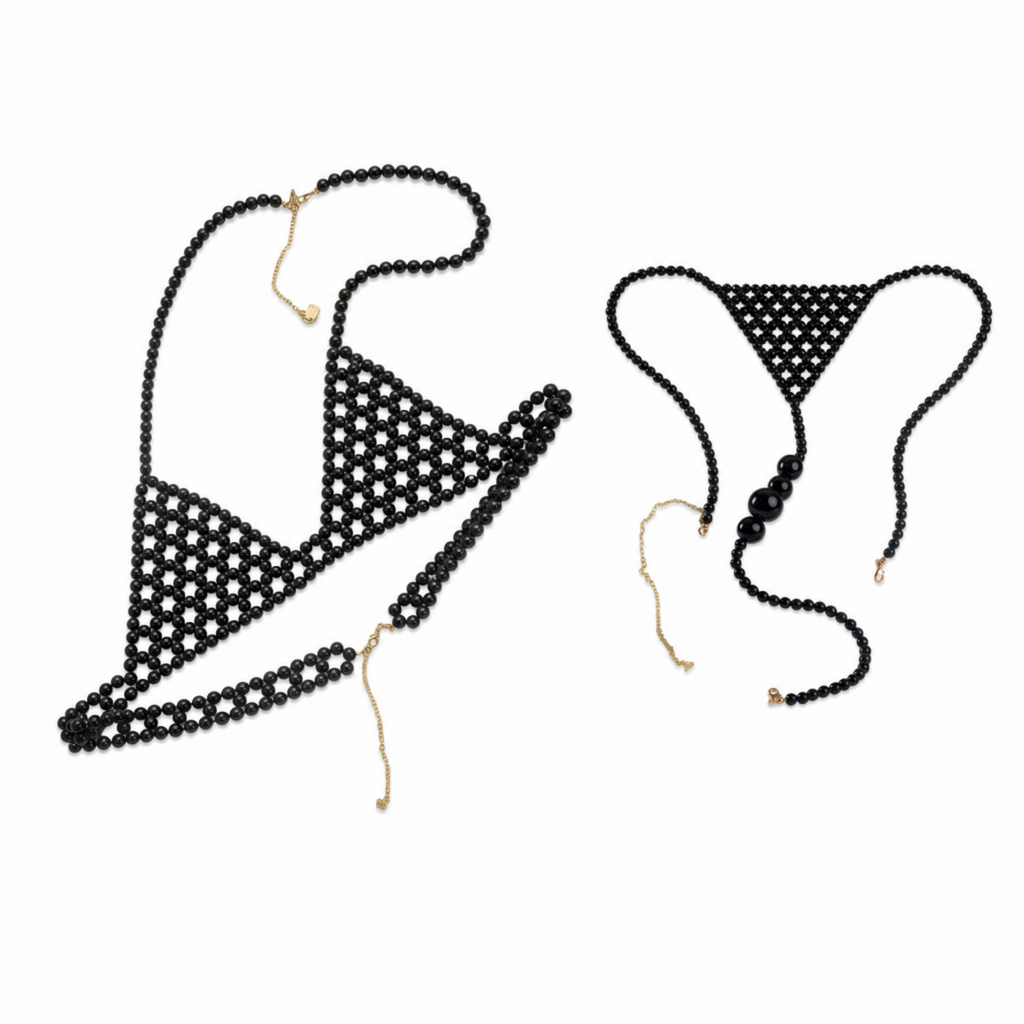Handmade Eclipse Noir body jewelry bundle featuring a matching black pearl bra and black pearl bikini with adjustable gold-tone chains by LUMI.