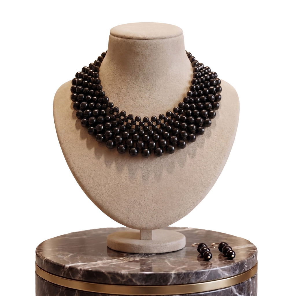 LUMI The Noir Cascade Jewelry Set displayed on a jewelry bust with matching earrings