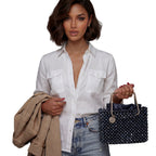 Model holding the Midnight Luminary navy crystal bag