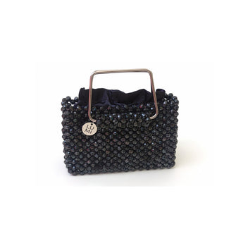 Midnight Luminary navy crystal bag with metallic top handle and satin lining