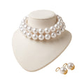 LUMI The Royale Pearl Jewelry Set featuring a handcrafted double-strand pearl choker and matching pearl earrings displayed on a jewelry bust