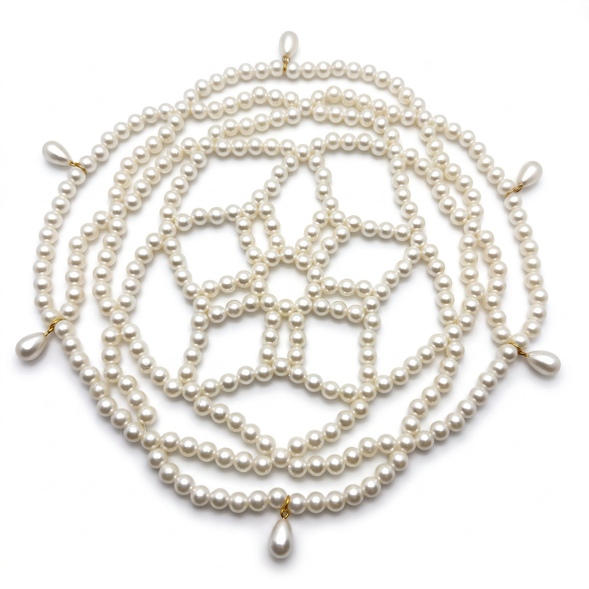Aurelia ivory pearl headpiece laid flat, lattice of pearl strands and teardrop accents