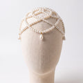 Aurelia ivory pearl headpiece on a mannequin, layered strands and teardrop accents