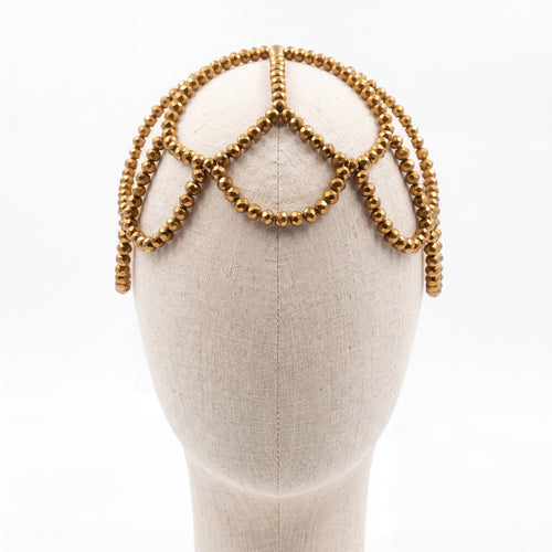 Gold crystal Aurelia headpiece on a mannequin, crown-like silhouette