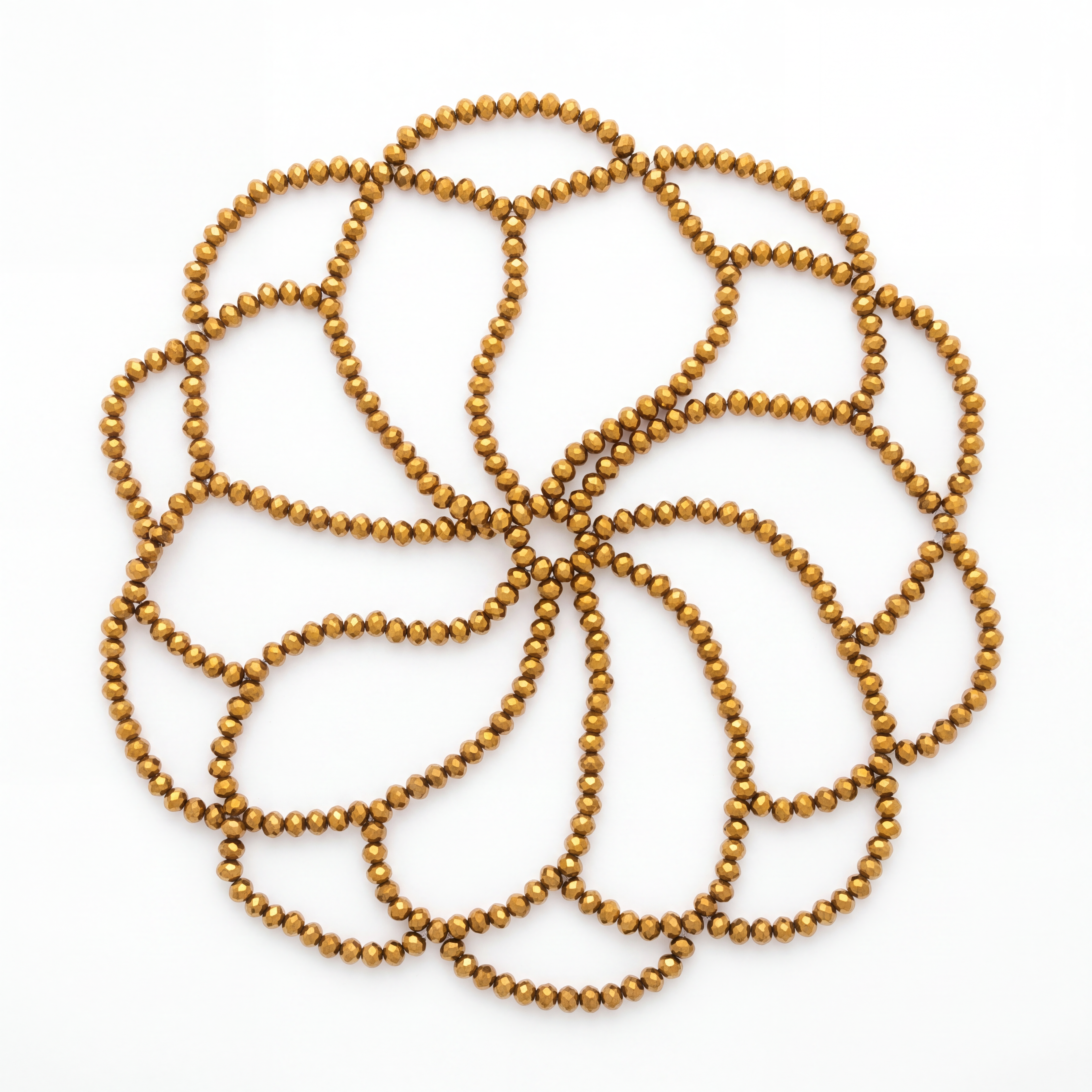 Handmade gold crystal headpiece laid flat showcasing its elegant draped bead design.