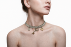 Model wearing the Handmade Whispering Key Charm Necklace by LUMI