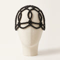 Aurelia Noir black pearl headpiece front view on ivory mannequin