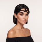 Woman wearing Aurelia Noir black pearl headpiece by LUMI