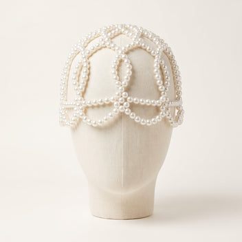 Front view of the handmade Aurelia White Pearl Headpiece displayed on a mannequin.