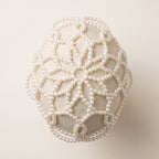 Top detail of the Aurelia White Pearl Headpiece showing its handmade lattice pearl construction.