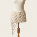 Front view of the adjustable Celeste Pearl Lattice Belt displayed on an ivory mannequin.