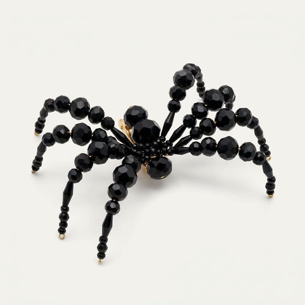 Handmade Arachné Crystal Spider Brooch – Noir by LUMI, featuring a three-dimensional spider silhouette crafted from faceted black glass crystal beads, displayed against a white studio background.
