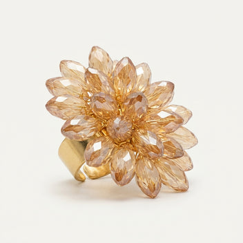 Detailed studio view of the LUMI Champagne Crystal Bloom Ring, highlighting its clustered faceted glass crystals arranged in an elegant flower-inspired design.