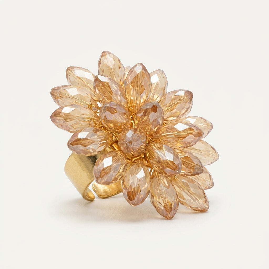 Detailed studio view of the LUMI Champagne Crystal Bloom Ring, highlighting its clustered faceted glass crystals arranged in an elegant flower-inspired design.