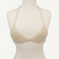 Front view of LUMI's handmade ivory pearl bra top, featuring triangular pearl-beaded cups, delicate halter straps and matching underbust bands.
