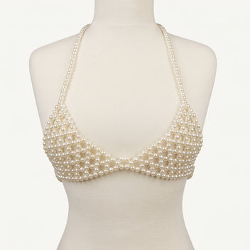 Front view of LUMI's handmade ivory pearl bra top, featuring triangular pearl-beaded cups, delicate halter straps and matching underbust bands.