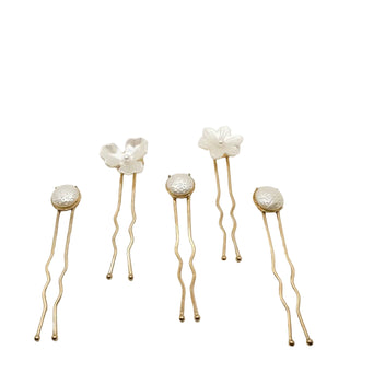 Five handmade Nacre Bloom Gold Hair Pins arranged together, showing the floral and round pearlescent designs.