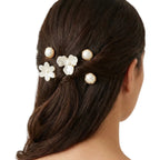 Nacre Bloom Gold Hair Pin Set styled at the back of a polished hairstyle with pearlescent floral and round accents.