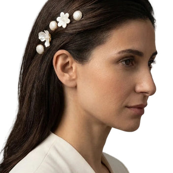 Woman wearing the Nacre Bloom Gold Hair Pin Set along sleek hair above the ear for an elegant occasion look.