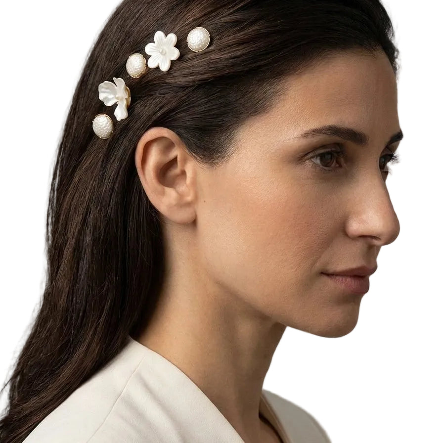 Woman wearing the Nacre Bloom Gold Hair Pin Set along sleek hair above the ear for an elegant occasion look.