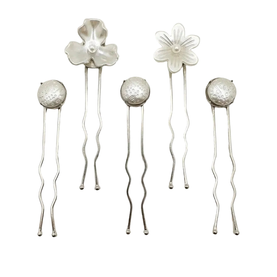 Five handmade Nacre Bloom Silver Hair Pins arranged together, showing floral and round pearlescent designs.