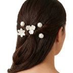 Nacre Bloom Silver Hair Pin Set styled at the back of a polished hairstyle with floral and pearlescent accents.