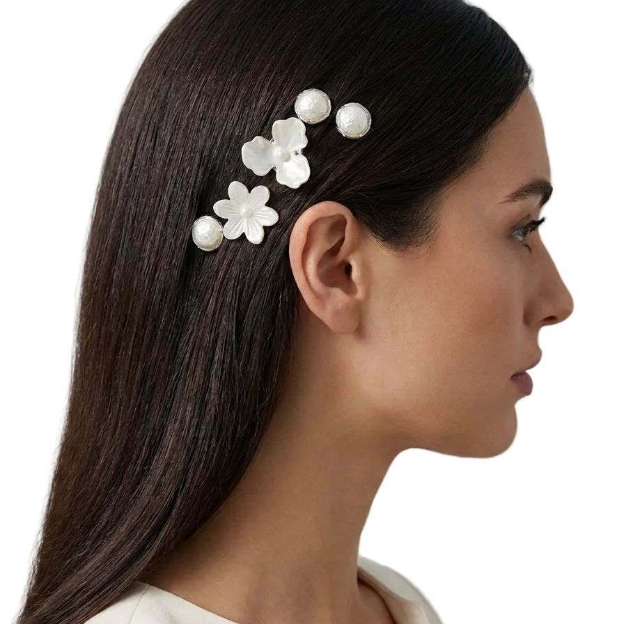 Woman wearing the Nacre Bloom Silver Hair Pin Set along sleek hair for an elegant occasion look.
