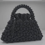 Close-up of the Velvet Caviar bag, crystal bead surface