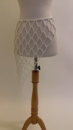 Video of the handmade Celeste Pearl Lattice Belt showing the adjustable white pearl lattice design, drape and gold-tone clasp by LUMI.