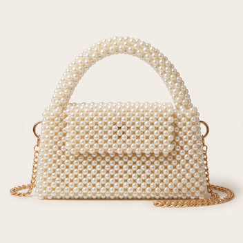 Front view of The Nacre Bag by LUMI, a structured pearl handbag with a pearl top handle and gold-tone chain strap.