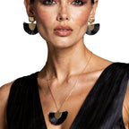Model wearing the handmade Velvet Noir gold-plated necklace and earrings set by LUMI.